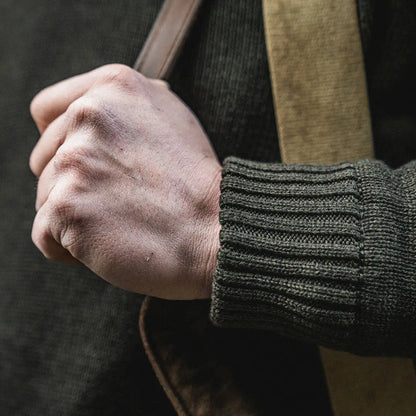 Clenched hand in Seeland Haze Windbreaker Knit Jumper with midweight wool-blend pullover
