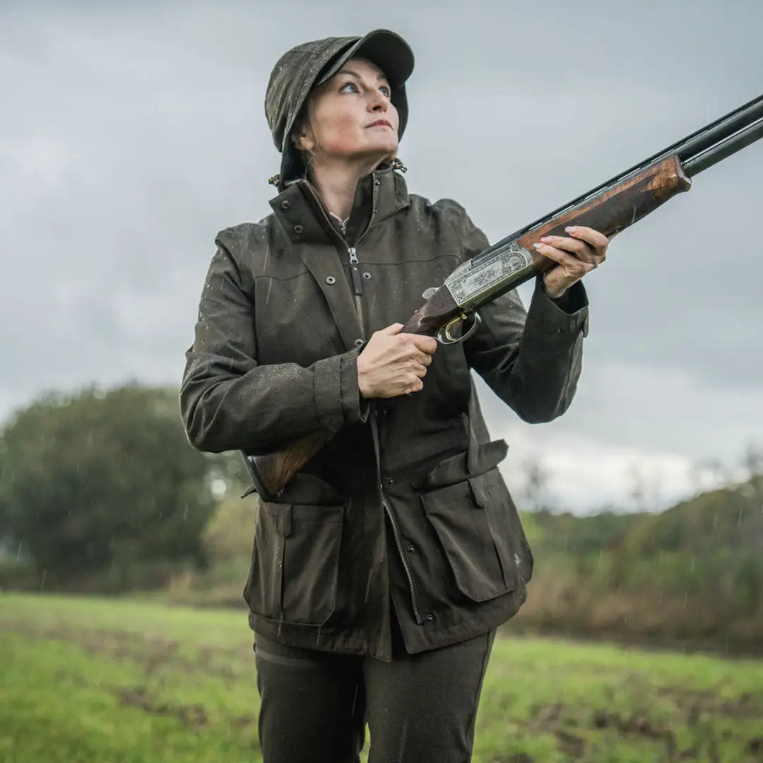 Woman holding a shotgun in Seeland Highpoint Womens Harriet Jacket for hunting or country clothing