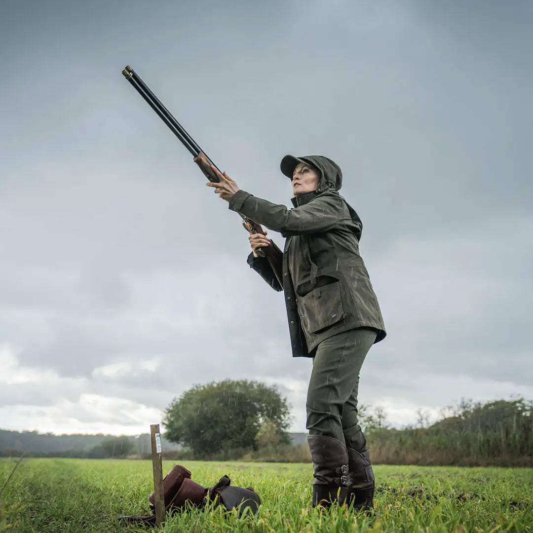 Woman aiming shotgun in Seeland Highpoint Womens Harriet Jacket for hunting and country clothing