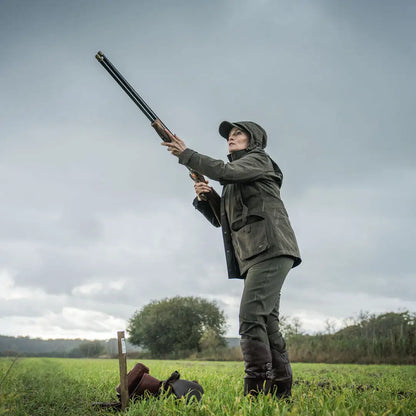 Woman aiming shotgun in Seeland Highpoint Womens Harriet Jacket for hunting and country clothing