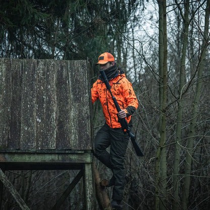 Hunter climbing tree stand with Seeland Iron Neckgaiter for total neck protection