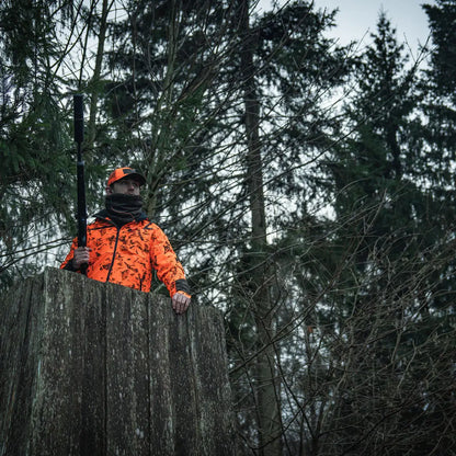 Hunter in orange camouflage with rifle wearing Seeland Iron Neck Gaiter for added comfort