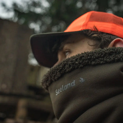 Hunter wearing orange hat and Seeland Iron Neckgaiter neck gaiter for outdoor gear