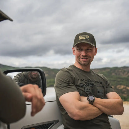 Man in olive green shirt and cap rocking Seeland Packing T-Shirt for outdoorsy vibes