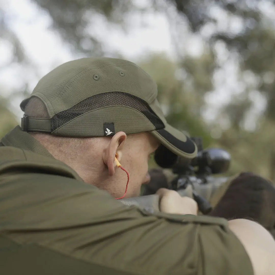 Olive green Seeland Selous Cap with earplugs, perfect for country clothing and hunting