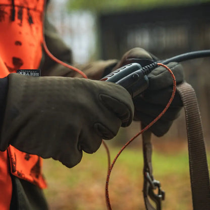 Gloved hands holding a shotgun wearing Seeland Target Gloves for hunting and country clothing