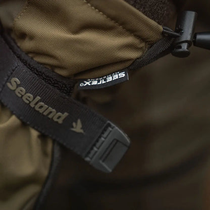 Olive green Seeland jacket with strap, perfect for country clothing and outdoor hunting trips