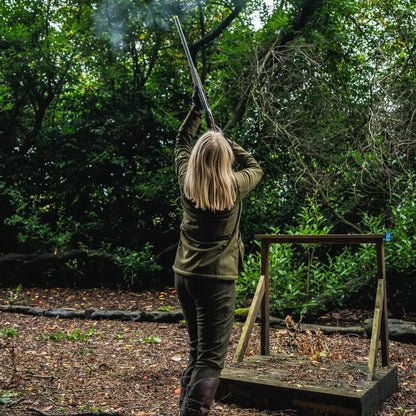 Woman firing a shotgun in Seeland Wenlock Faye jacket, perfect for country clothing and hunting