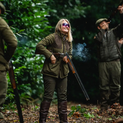 Woman holding a shotgun in a Seeland Wenlock Faye Ladies Jacket, perfect for hunting