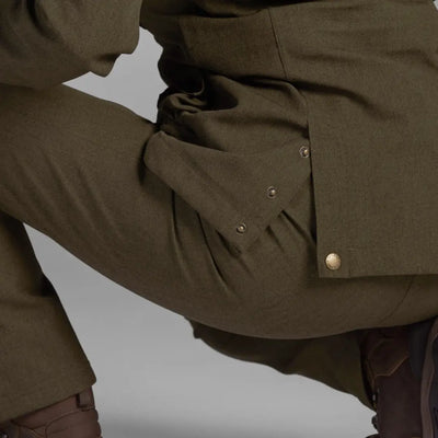 Olive green Woodcock Advanced Jacket with brass buttons and pockets for stylish practicality