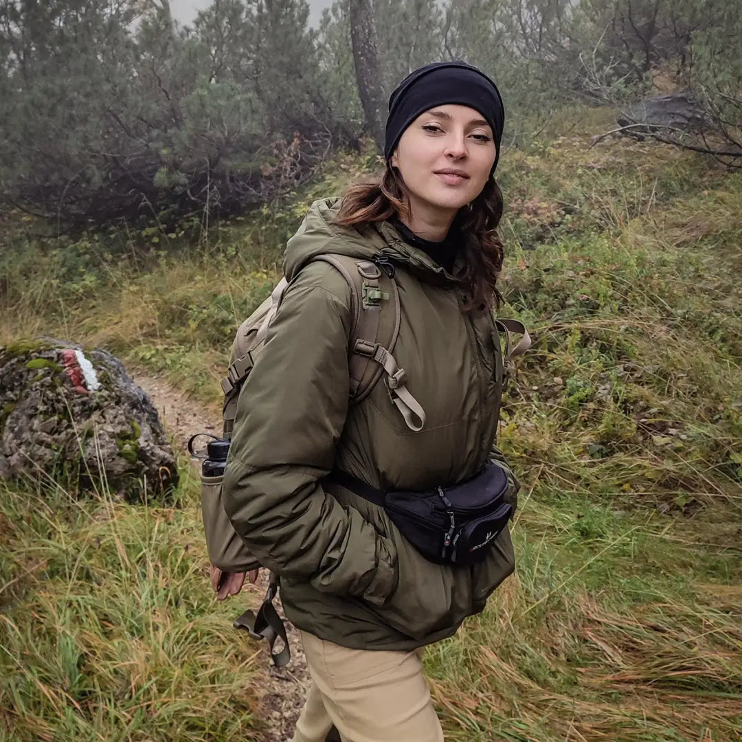 Woman in hiking gear enjoying nature in Snugpak Spearhead Technical Midweight Jacket