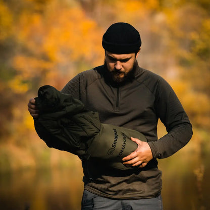 Bearded man showing off Snugpak Tomahawk Cold Weather Insulated Jacket in autumn
