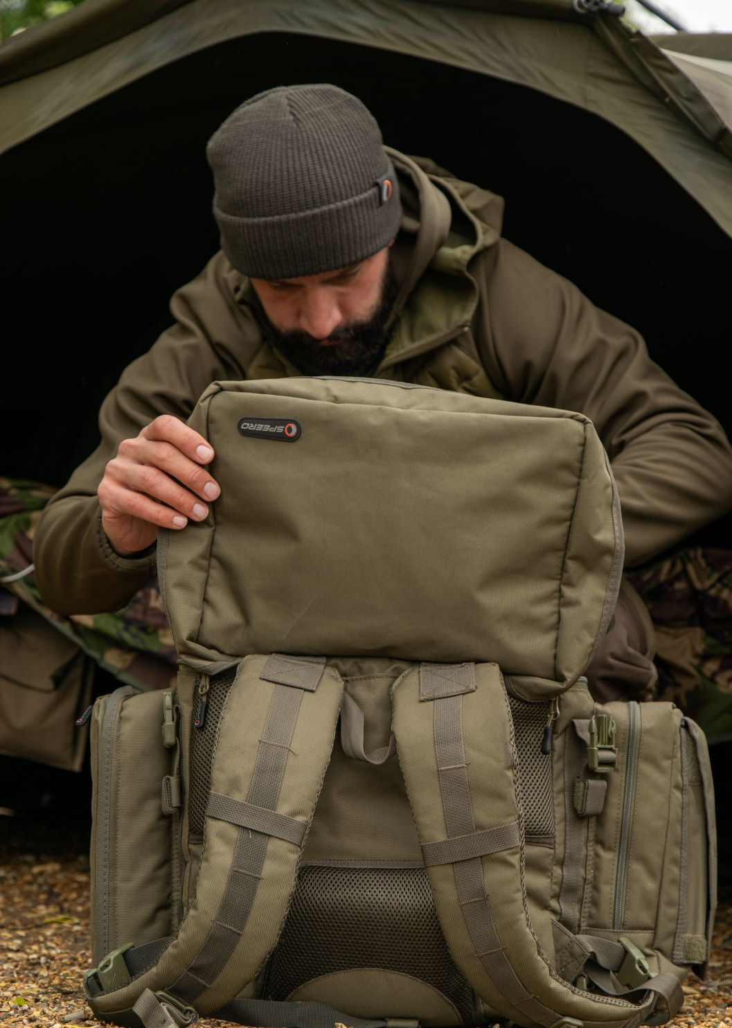Olive green backpack paired with stylish Speero Bob Hat for fashion-forward adventures