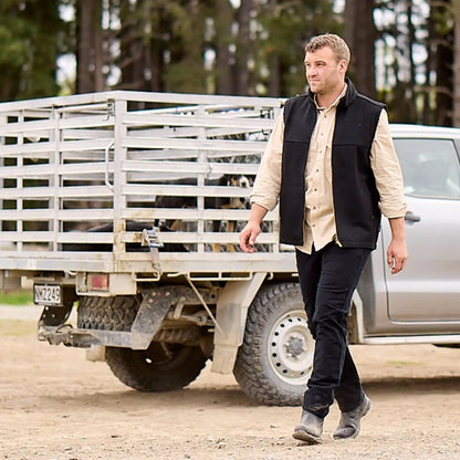 Man in a black vest rocking the Swanndri Byron Work Shirt, perfect country clothing