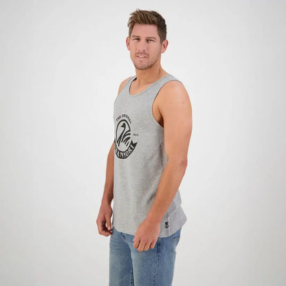 Man in a light gray tank top featuring a circular logo from Swanndri Classic V2 Printed Singlet