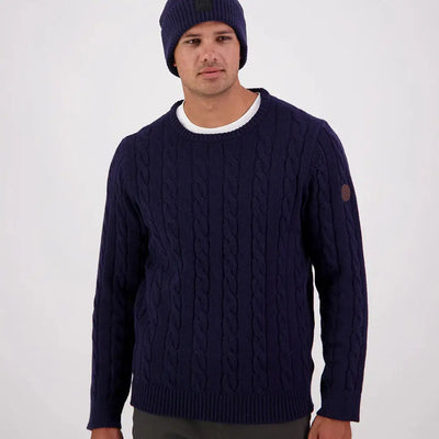 Men’s navy blue Swanndri Doncaster Mens cable knit crewneck sweater with brown patch