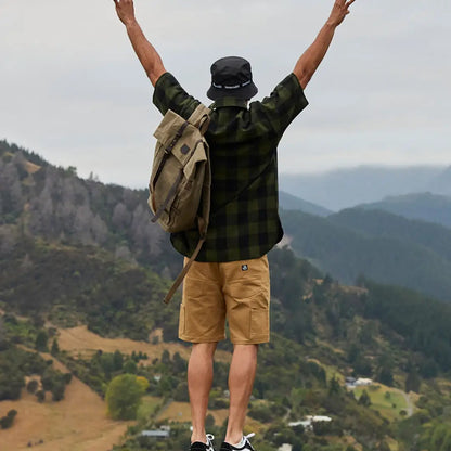 Man celebrating in nature wearing Swanndri Glenbrook V3 Men’s Work Shorts for outdoor fun
