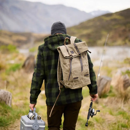 Hiker in Hudson Wool Hoody exploring nature with fishing gear and backpack