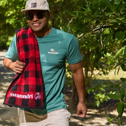 Man in plaid towel wearing a Swanndri Pop Printed T Shirt, perfect for country clothing