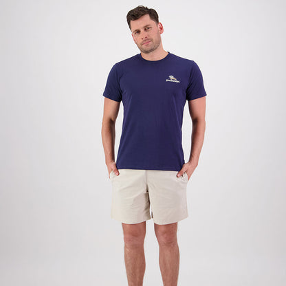 Man in navy t-shirt and khaki shorts showcasing Swanndri Pop Top for country clothing adventures