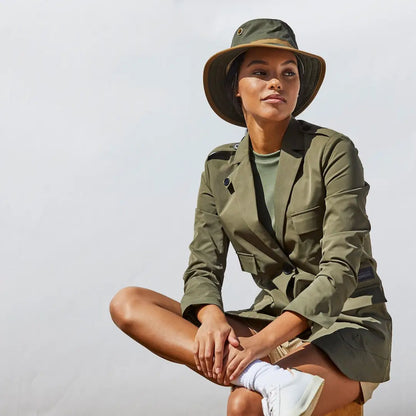 Woman in khaki safari outfit showcasing Tilley TWC7 handmade heritage hat for highest sun protection