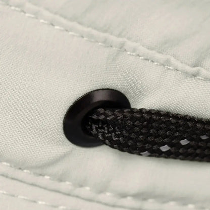 Black drawstring through grommet on Tilley Ultralight T5 Classic made from recycled nylon