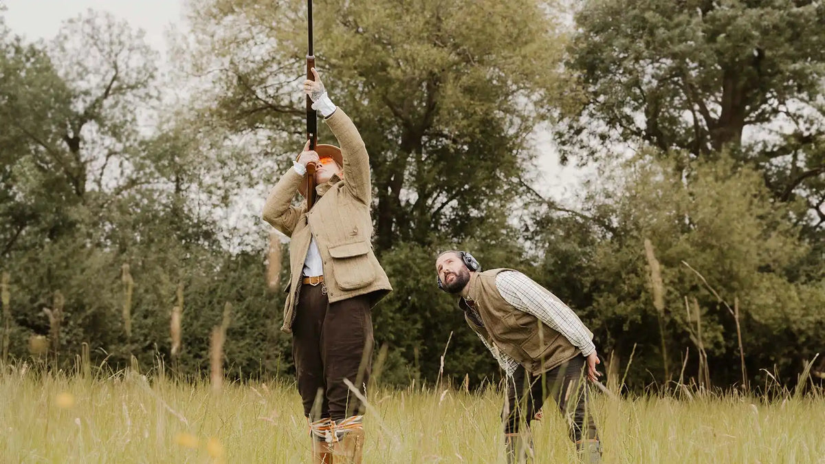 Two men in hunting attire.