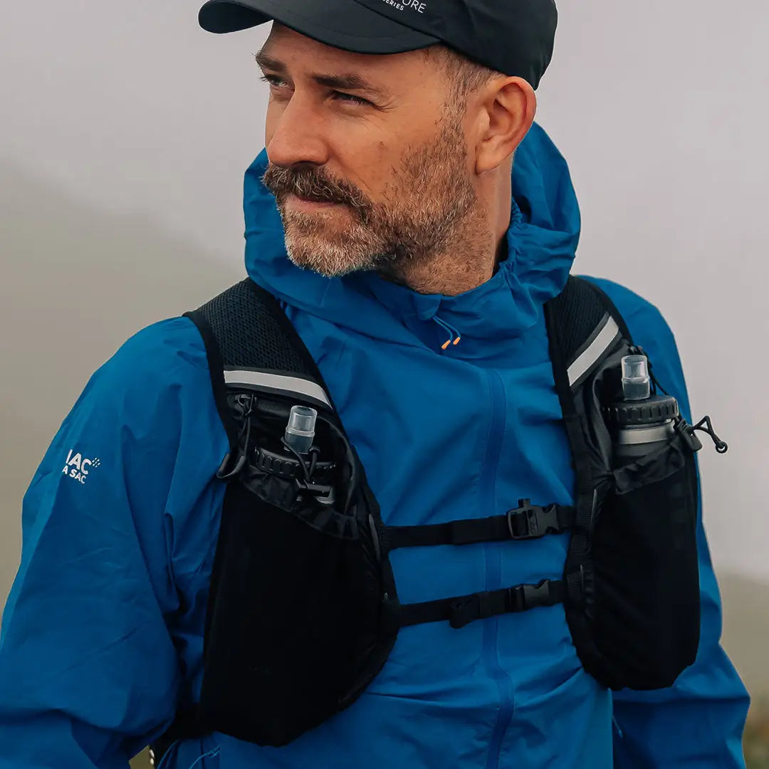 Man using a hydration vest with the Venture Speedpro Backpack for outdoor adventures