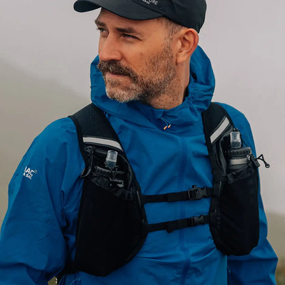 Man using a hydration vest with the Venture Speedpro Backpack for outdoor adventures