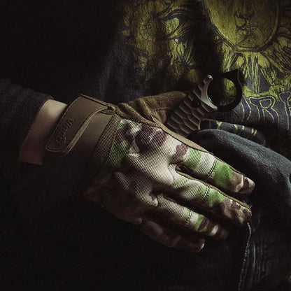 Camouflage-patterned Viper VX Tactical Glove on hand for country clothing adventures
